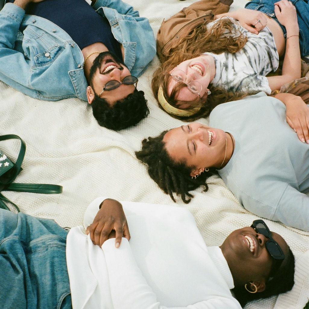 Young adults lying on the ground