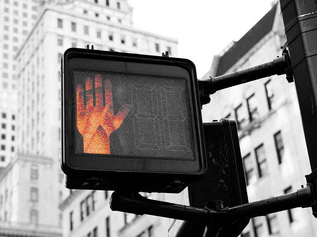 stop signal on a crosswalk sign